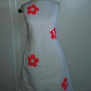 Beautiful White Dress with Orange decals.